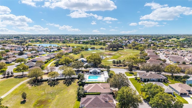 birds eye view of property featuring golf course view, a residential view, and a water view