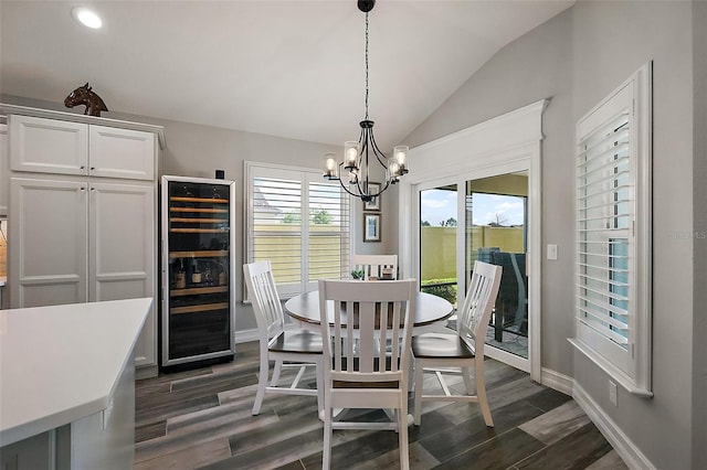 5557 Hawkins Dr, The Villages, FL 32163 - dining area with dark wood finished floors, a notable chandelier, lofted ceiling, and beverage cooler