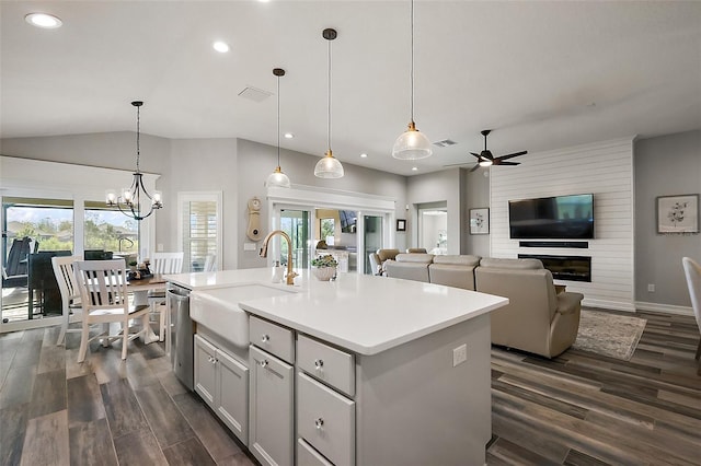 5557 Hawkins Dr, The Villages, FL 32163 - kitchen with dark wood-style flooring, a sink, recessed lighting, and ceiling fan with notable chandelier