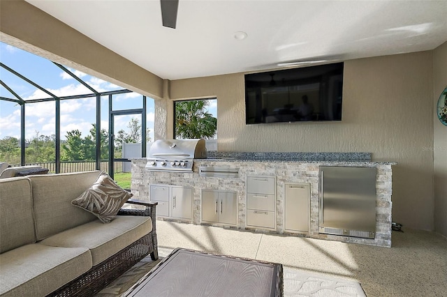 5557 Hawkins Dr, The Villages, FL 32163 - view of patio featuring grilling area, a lanai, an outdoor living space, and an outdoor kitchen
