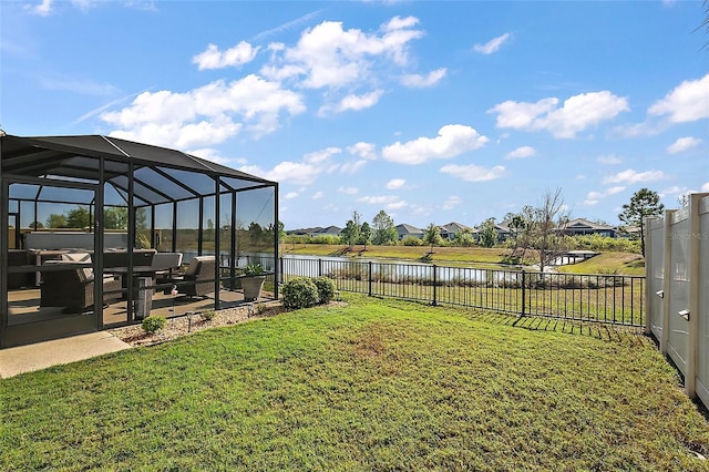 5557 Hawkins Dr, The Villages, FL 32163 - view of yard with a fenced backyard, a residential view, a lanai, and a water view