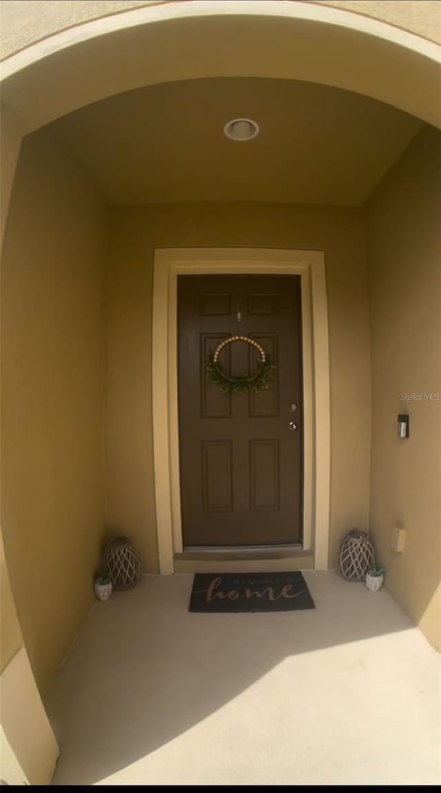 144 Primrose Dr, Davenport, FL 33837 - view of exterior entry featuring stucco siding