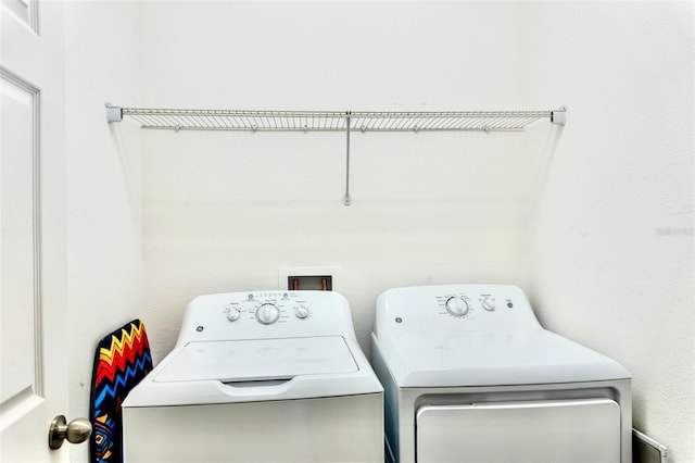 144 Primrose Dr, Davenport, FL 33837 - laundry area with laundry area and separate washer and dryer