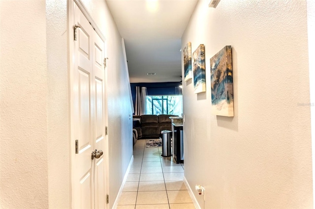 144 Primrose Dr, Davenport, FL 33837 - hallway with light tile patterned floors and baseboards