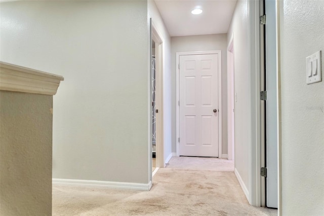 144 Primrose Dr, Davenport, FL 33837 - hallway featuring baseboards and light colored carpet