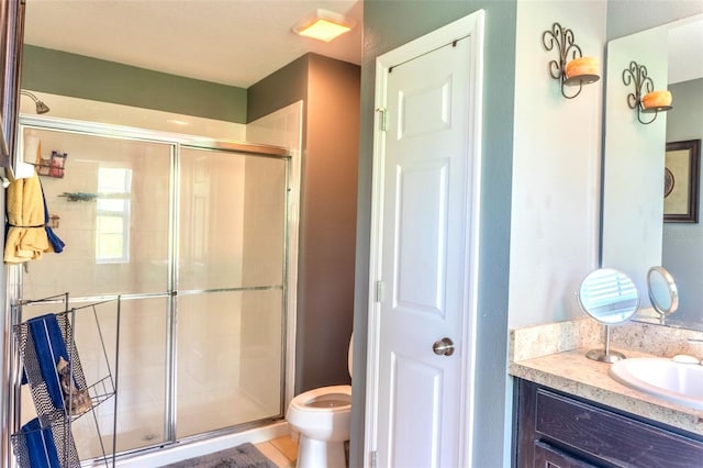 144 Primrose Dr, Davenport, FL 33837 - bathroom featuring a shower stall, toilet, and vanity