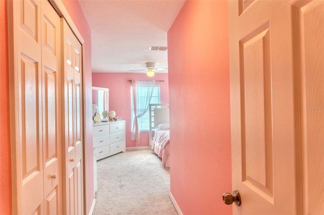 144 Primrose Dr, Davenport, FL 33837 - corridor with light colored carpet, visible vents, and baseboards