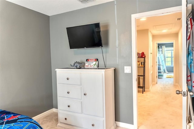 144 Primrose Dr, Davenport, FL 33837 - bedroom featuring baseboards, visible vents, attic access, and light colored carpet