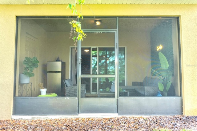 144 Primrose Dr, Davenport, FL 33837 - doorway to property with stucco siding