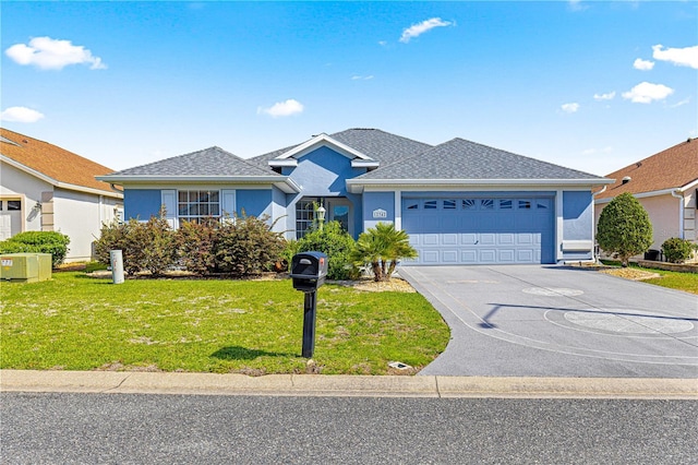 ranch-style home with stucco siding, driveway, a front lawn, and an attached garage