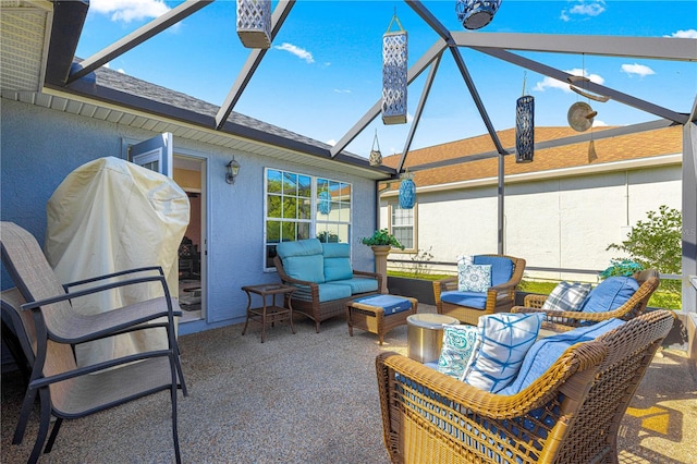 view of patio / terrace with glass enclosure and an outdoor living space
