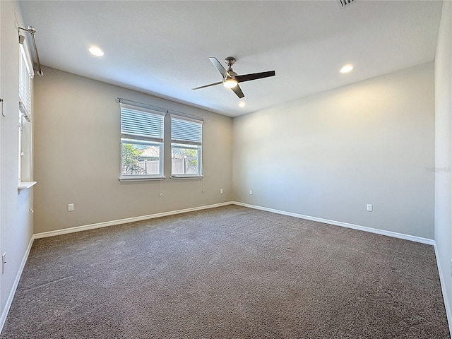 carpeted empty room with recessed lighting, a ceiling fan, and baseboards