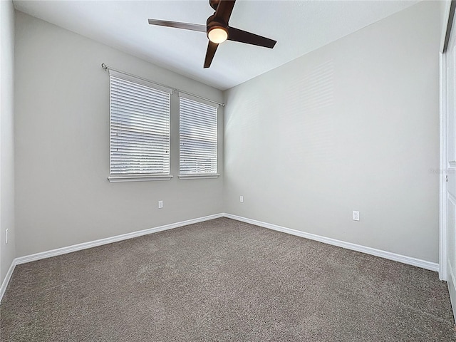 empty room featuring a ceiling fan, baseboards, and carpet