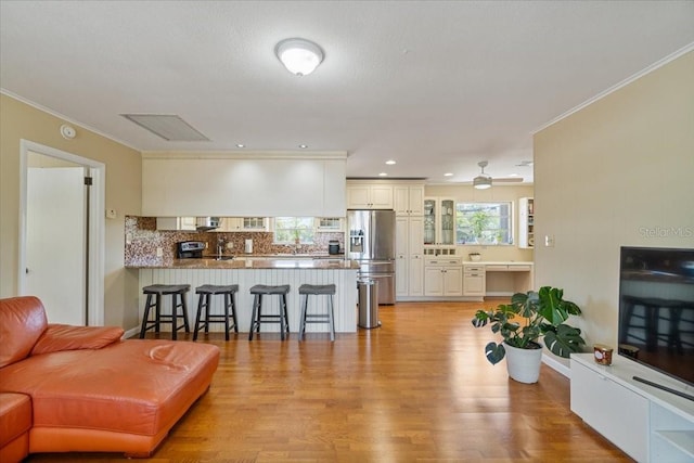 29051 Magnolia Ln, Big Pine Key, FL 33043 - living room with light wood-type flooring, crown molding, recessed lighting, and a ceiling fan