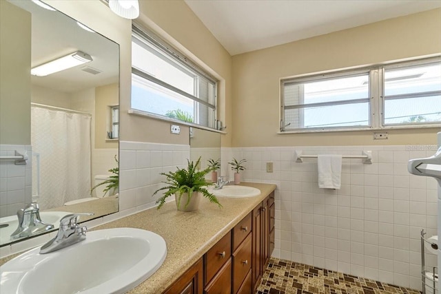 29051 Magnolia Ln, Big Pine Key, FL 33043 - bathroom featuring wainscoting, a sink, and a healthy amount of sunlight