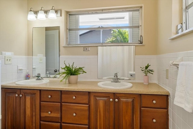29051 Magnolia Ln, Big Pine Key, FL 33043 - bathroom with double vanity, a sink, and tile walls