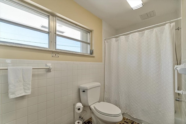 29051 Magnolia Ln, Big Pine Key, FL 33043 - bathroom with tile walls, visible vents, a shower with shower curtain, toilet, and wainscoting