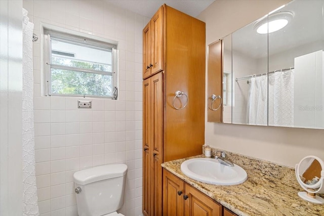 29051 Magnolia Ln, Big Pine Key, FL 33043 - bathroom with toilet, vanity, curtained shower, and tile walls