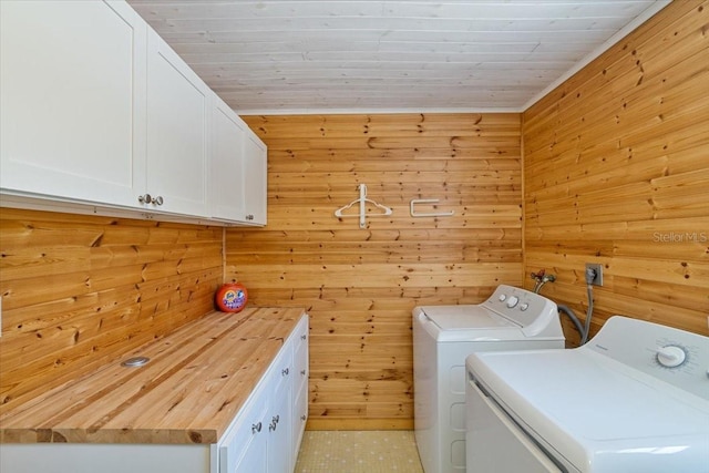 29051 Magnolia Ln, Big Pine Key, FL 33043 - laundry room with washing machine and clothes dryer, wood ceiling, cabinet space, and wood walls
