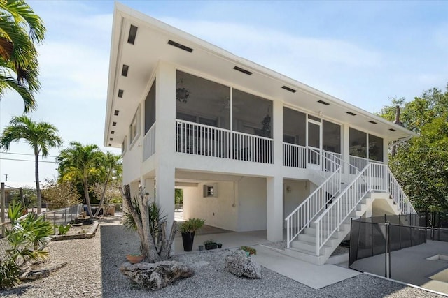 29051 Magnolia Ln, Big Pine Key, FL 33043 - view of building exterior featuring stairs and fence