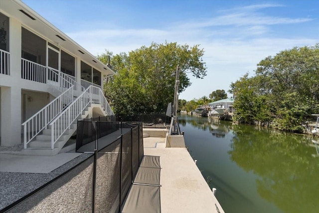 29051 Magnolia Ln, Big Pine Key, FL 33043 - dock area featuring a patio, a water view, and stairs