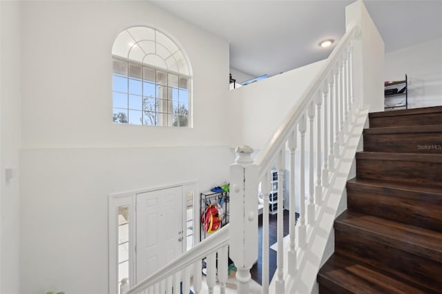 staircase with a high ceiling