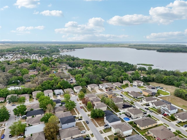 bird's eye view featuring a residential view and a water view