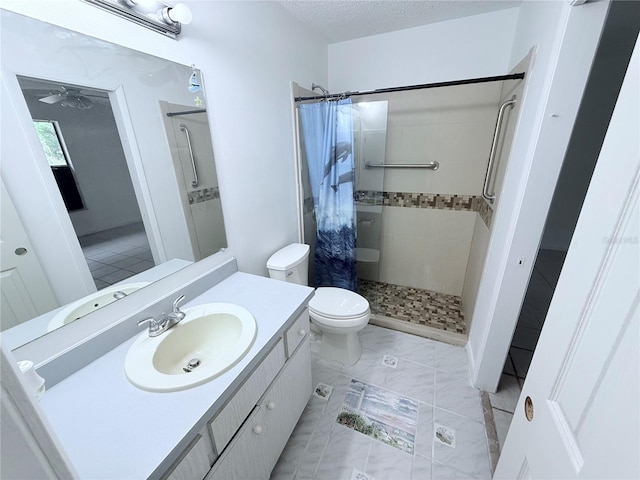 2423 Centennial Blvd, Leesburg, FL 34748 - bathroom with toilet, vanity, a shower stall, a textured ceiling, and ceiling fan
