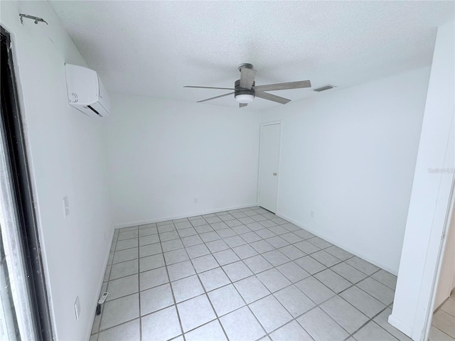 2423 Centennial Blvd, Leesburg, FL 34748 - empty room featuring a ceiling fan, an AC wall unit, a textured ceiling, and visible vents