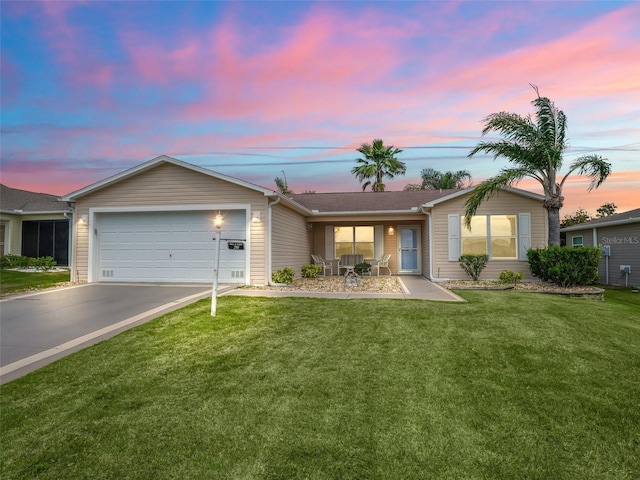 2111 Harston Trl, The Villages, FL 32162 - ranch-style house with a front lawn, a garage, and aphalt driveway
