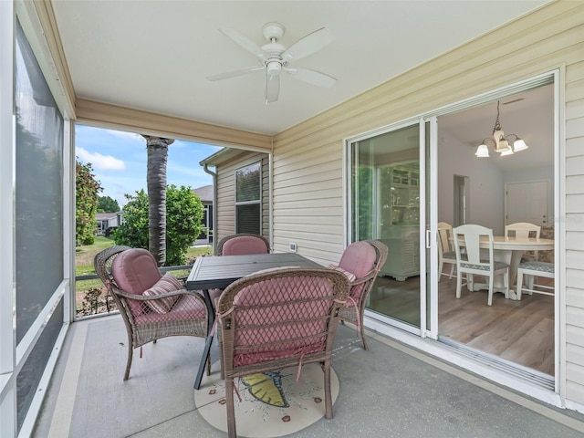 2111 Harston Trl, The Villages, FL 32162 - sunroom with outdoor dining space and ceiling fan with notable chandelier