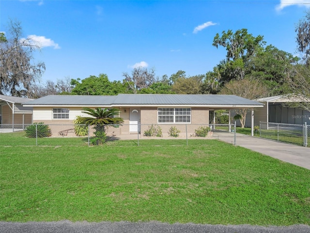 2376 Crk 444, Lake Panasoffkee, FL 33538 - ranch-style house with metal roof, fence, a front lawn, and concrete driveway