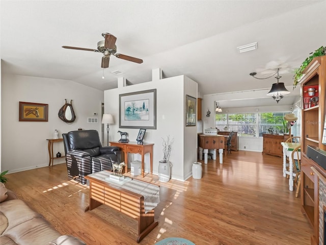 2376 Crk 444, Lake Panasoffkee, FL 33538 - living area with visible vents, ceiling fan, wood finished floors, and vaulted ceiling
