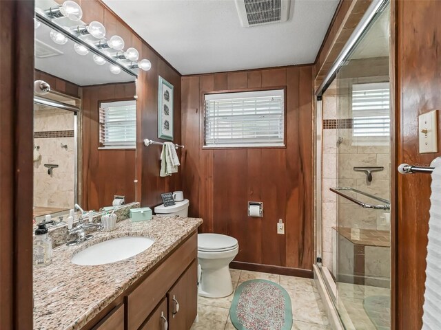 2376 Crk 444, Lake Panasoffkee, FL 33538 - full bath with a shower stall, visible vents, toilet, and wood walls