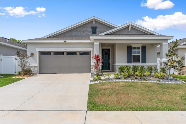 6003 Nightjar Ct, Okahumpka, FL 34762 - craftsman inspired home featuring stone siding, a gate, a garage, a front yard, and driveway
