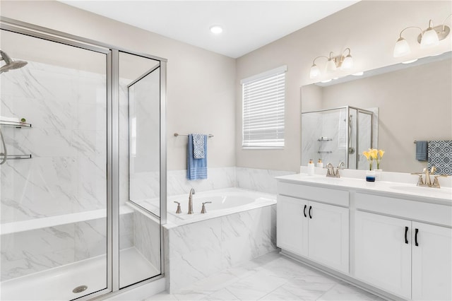 6003 Nightjar Ct, Okahumpka, FL 34762 - bathroom featuring marble finish floor, a garden tub, a sink, and a marble finish shower