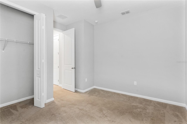 6003 Nightjar Ct, Okahumpka, FL 34762 - unfurnished bedroom with baseboards, carpet floors, and visible vents