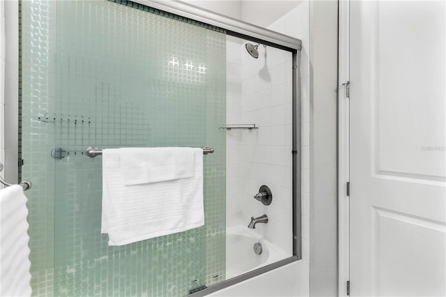 6003 Nightjar Ct, Okahumpka, FL 34762 - full bath featuring bath / shower combo with glass door