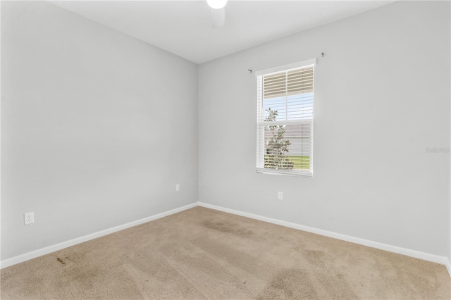 6003 Nightjar Ct, Okahumpka, FL 34762 - unfurnished room featuring carpet floors, baseboards, and ceiling fan
