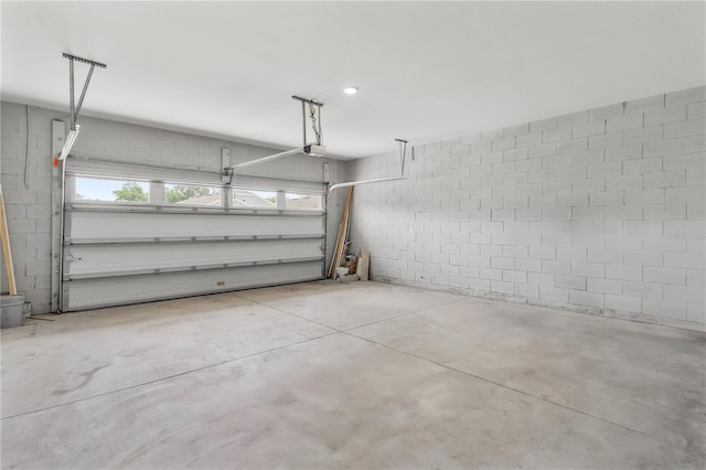 6003 Nightjar Ct, Okahumpka, FL 34762 - garage featuring concrete block wall