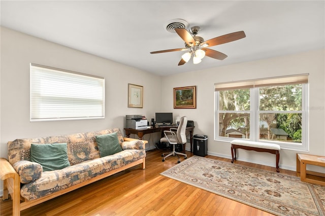 office with wood finished floors and ceiling fan