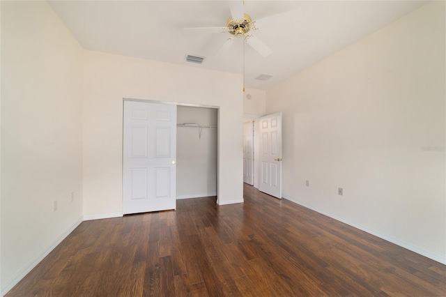 unfurnished bedroom with baseboards, dark wood finished floors, ceiling fan, visible vents, and a closet