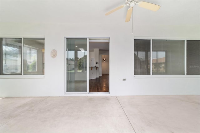 view of patio featuring ceiling fan