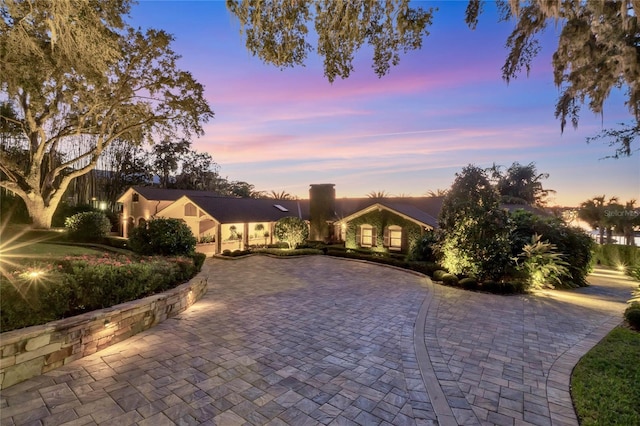 1945 Overlook Dr, Mount Dora, FL 32757 - view of front facade featuring curved driveway