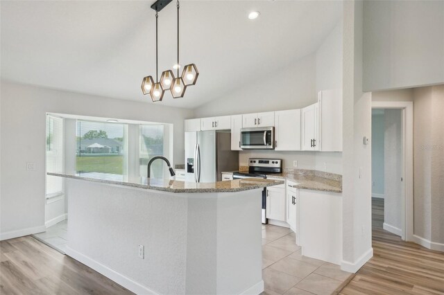 2575 SE 75th Blvd, Bushnell, FL 33513 - kitchen featuring white cabinetry, lofted ceiling, stainless steel appliances, light stone counters, and a notable chandelier