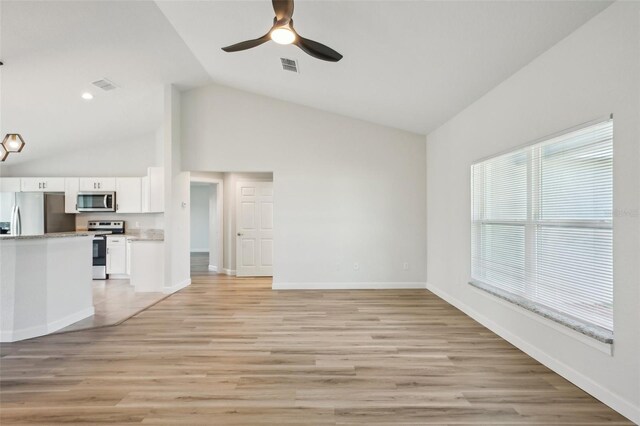 2575 SE 75th Blvd, Bushnell, FL 33513 - unfurnished living room featuring baseboards, light wood-style flooring, visible vents, and a ceiling fan