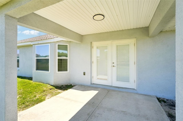 2575 SE 75th Blvd, Bushnell, FL 33513 - view of exterior entry featuring stucco siding