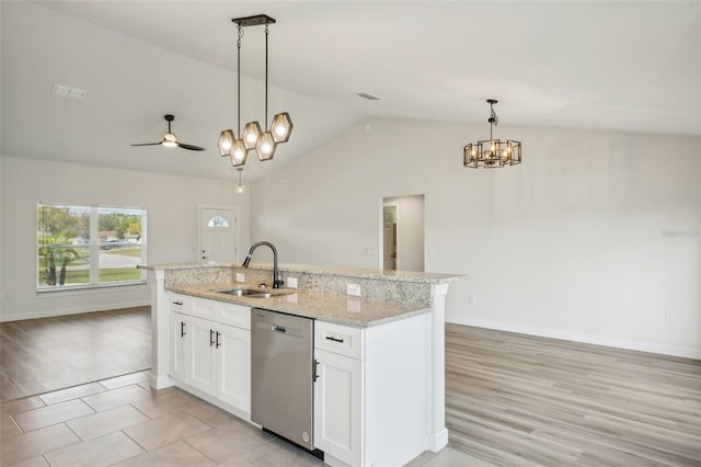2575 SE 75th Blvd, Bushnell, FL 33513 - kitchen with a sink, stainless steel dishwasher, a center island with sink, open floor plan, and hanging light fixtures
