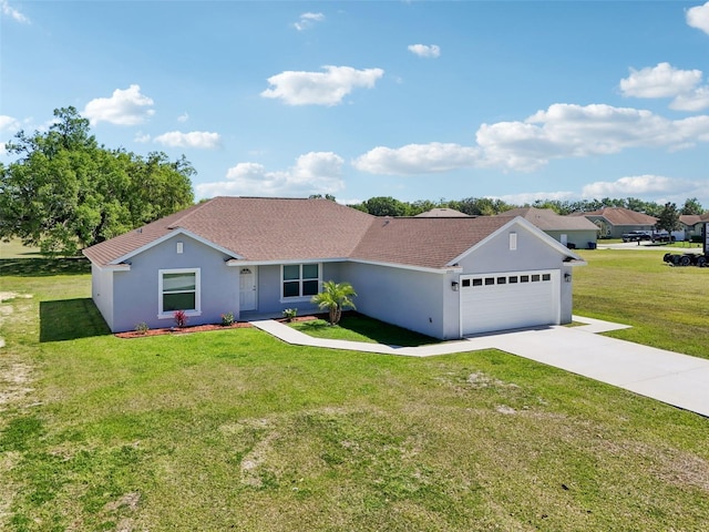 2575 SE 75th Blvd, Bushnell, FL 33513 - ranch-style house featuring driveway, an attached garage, a front lawn, roof with shingles, and stucco siding