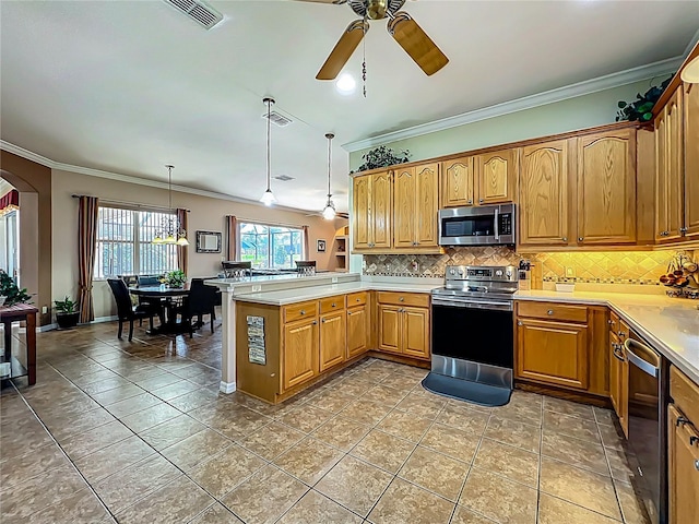 25545 Laurel Valley Rd, Leesburg, FL 34748 - kitchen with crown molding, a peninsula, stainless steel appliances, visible vents, and decorative backsplash